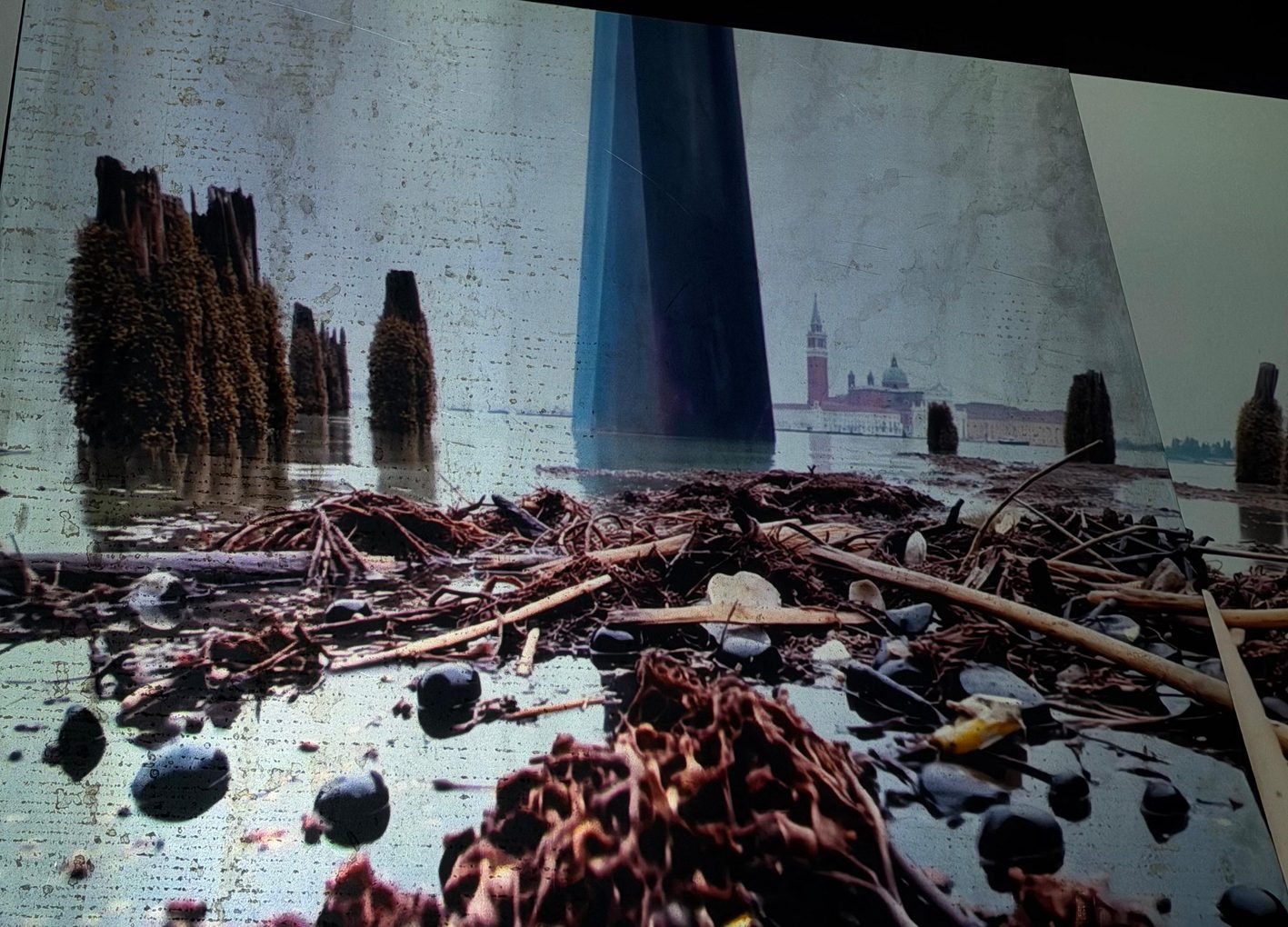 Yes...But — After Venice, the Venetian lagoon projected over debris, ex Pirelli library, Milan